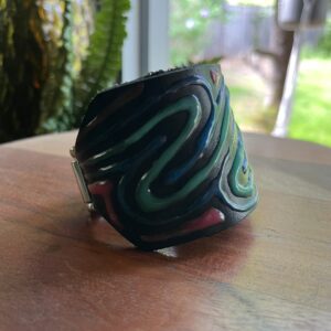 Leather cuff with glow in the dark paint